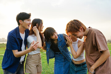 Image of a group of young Asian people laughing happily together