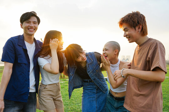 Image of a group of young Asian people laughing happily together