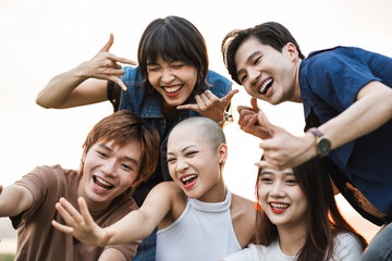 Image of a group of young Asian people laughing happily together