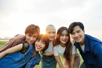 Image of a group of young Asian people laughing happily together