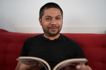 Man Reading a Funny Book, Bursting into Laughter