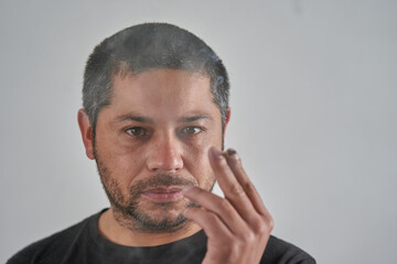 Cigarette Smoker in a Clean White Setting