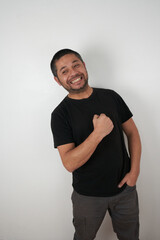 Friendly and Optimistic Man Poses Against Neutral Backdrop