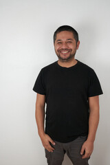Friendly Face: Man Smiling on a Neutral Background