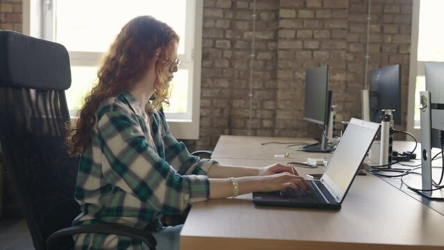 A diverse group of colleagues collaborates using laptops, mobiles, and tablets to tackle business challenges and enhance productivity through teamwork and innovative technology.