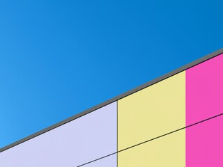 Minimally colored building facade with blue sky background
