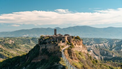Stunning aerial view of the small mountain town of Civita di Bagnoregio in Italy. - obrazy, fototapety, plakaty