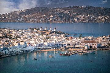 A stunning Mykonos vista: White houses against a breathtaking sea backdrop, a picture of Greek island paradise.