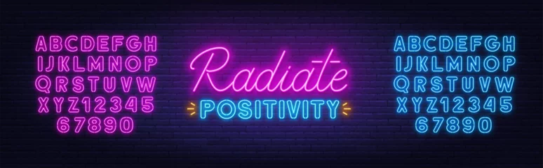 Gartenposter Radiate Positivity neon lettering on brick wall background. © TanyaFox