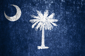 Close-up of the grunge South Carolina state flag. Dirty South Carolina state flag on a metal...