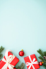 Christmas background. Christmas present box and decorations at blue. Flat lay image with copy space.