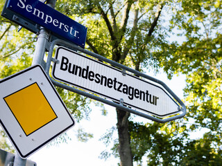 Arrow sign to the Bundesnetzagentur (Federal Network Agency) in Germany. The governmental office...