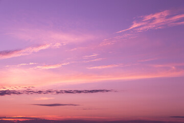 Naklejka na ściany i meble Pink purple violet beautiful sky. Beautiful soft gentle sunrise, sunset with cirrus clouds background texture