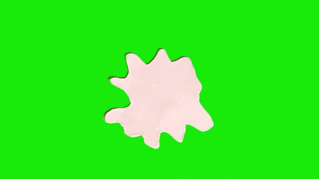 Plasticine white spot falling on a green chromakey background. Stop motion animation