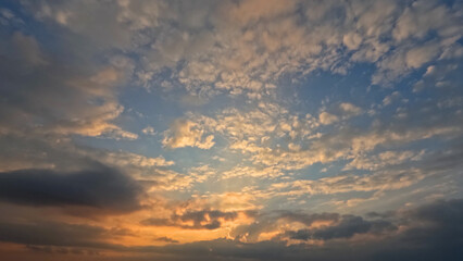 Naklejka na ściany i meble pretty sunrise goldish clouds on the sky bg - photo of nature