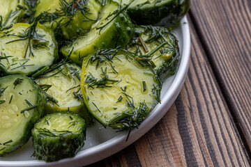 sliced dill pickles for hamburger top view. .Marinated  cucumbers with herbs and spices.