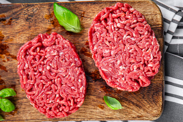 ground meat raw cutlet fresh beef meat hamburger eating cooking appetizer meal food snack on the table copy space food background rustic top view - obrazy, fototapety, plakaty