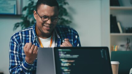 Professional programmer happy with successful project completion, gesturing yes