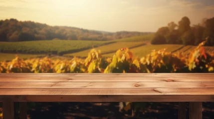 Fotobehang Wooden table in an autumn evening landscape with free space on the table for simulating product display. Winery and wine tasting concept © Panyamethi