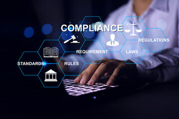 Compliance concept with businessman working with laptop to apply requirement for standard...