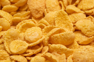 Background of corn flakes close-up. Healthy breakfast