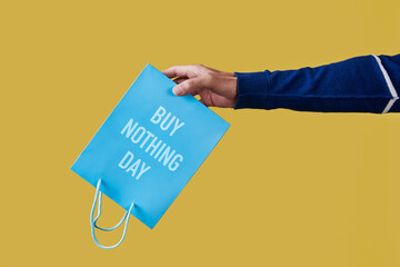 text buy nothing day written in a shopping bag