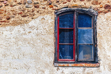 Fototapeta na wymiar Window of an old stone house