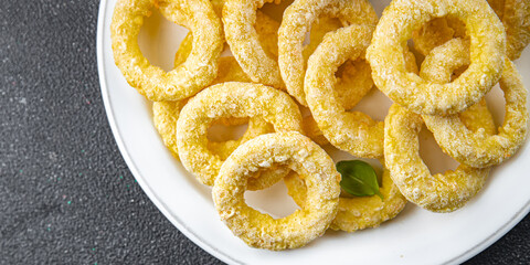 onion rings batter deep fryer tomato sauce fast food eating cooking appetizer meal food snack on the table copy space food background rustic top view