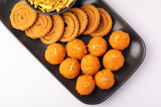 Indian sweet motichoor laddoo also know as Bundi laddu or Motichur Laddoo are made of very fine gram flour balls or Boondis which are deep fried, served with Chakkli or Murruku