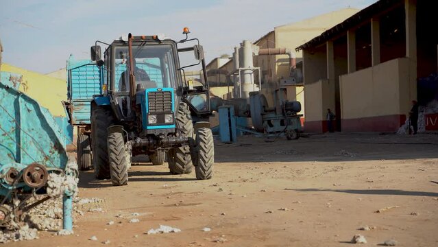 Pastdargam disctrict, Juma city, uzbekistan, October 31, 2023: big machines and tractors working in a cotton industry