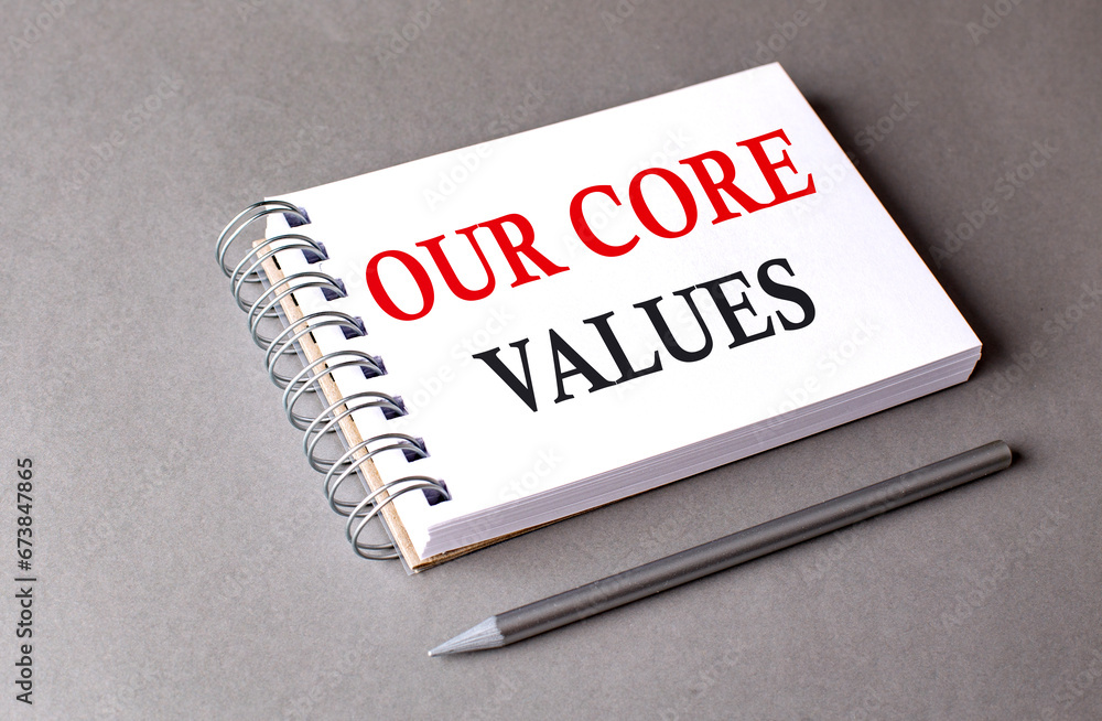 Aufkleber our core values word on notebook on grey background