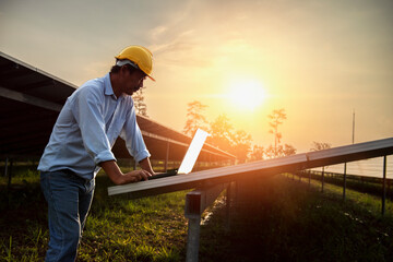 Assistance technical worker in uniform is checking an operation and efficiency performance of photovoltaic solar panels.