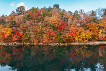 Idyllic landscape of lake and forest of Nikko national park in Japan in autumn season