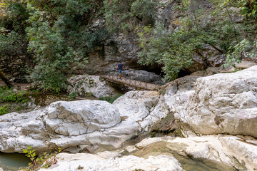 Tourists trekking on the river trail to and from the Nydri Waterfall. Lefkada. Greece.