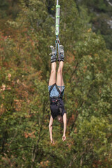 Bungee jumping young woman