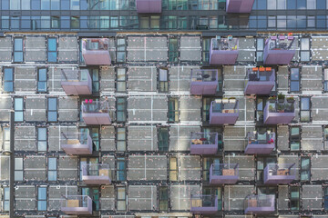 Re-cladding work in progress on a block of flats in Stratford, east London, England