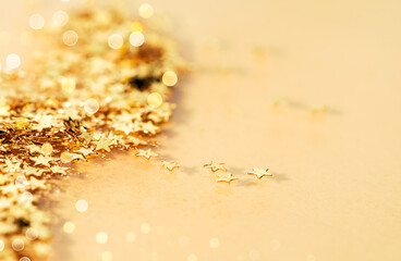 Decorative Golden Christmas Stars Close-up. Festive and Holidays Concept. Copy space for your text.