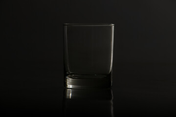 Empty glass on black