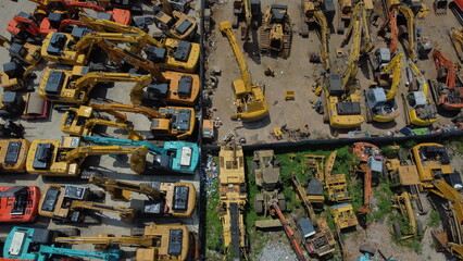 A fleet of excavators stands ready in Shanghai, the muscle of modern China's construction