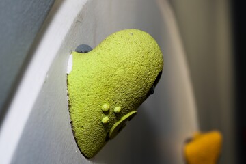 Closeup of a green artificial rock climbing hold