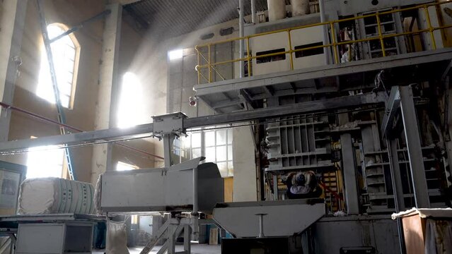 Pastdargam disctrict, Juma city, uzbekistan, October 31, 2023: many people working near the hydraulic pressing system in Cotton industry