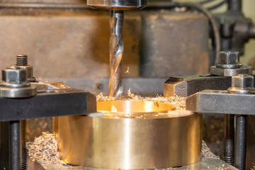 The drilling process on NC milling machine with brass material.