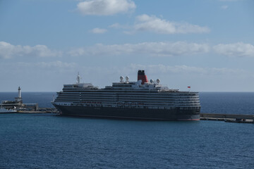 Classic british luxury ocean liner cruiseship cruise ship in port with detail view of steel hull,...
