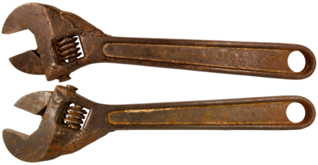 Closeup of an old rusty adjustable wrench isolated on white or transparent background, png. 19th century, Italy.
