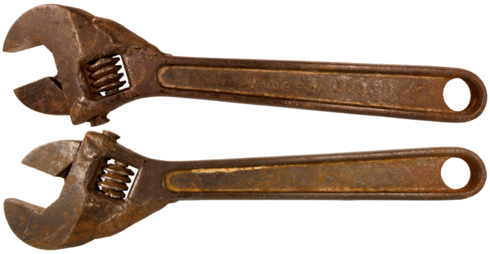 Closeup of an old rusty adjustable wrench isolated on white or transparent background, png. 19th century, Italy.