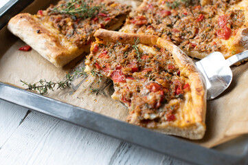 Minced meat pizza on a baking sheet selective focus