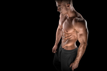Fototapeta premium Young bodybuilder side view looking down