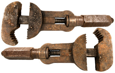 Closeup of an old rusty adjustable wrench isolated on white or transparent background, png. 19th century, Italy.