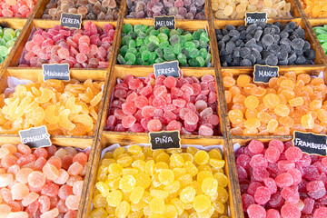 Colorful assortment of sugar homemade candies with different fruit flavors
Translated text (and types of sweets): gooseberry, mandarin, cherry, mango, pineapple, strawberry, raspberry, melon, licorice