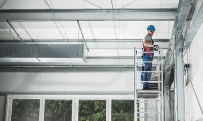 Air Heating and Cooling Technician Assembling Air Duct Elements - obrazy, fototapety, plakaty